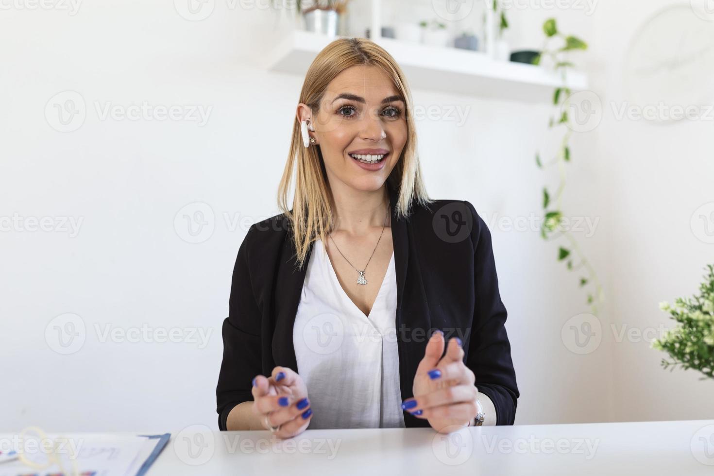 Headshot portrait screen view of smiling young woman sit at home talk on video call with friend or relative, happy young woman speaking online using Webcam conference on computer photo