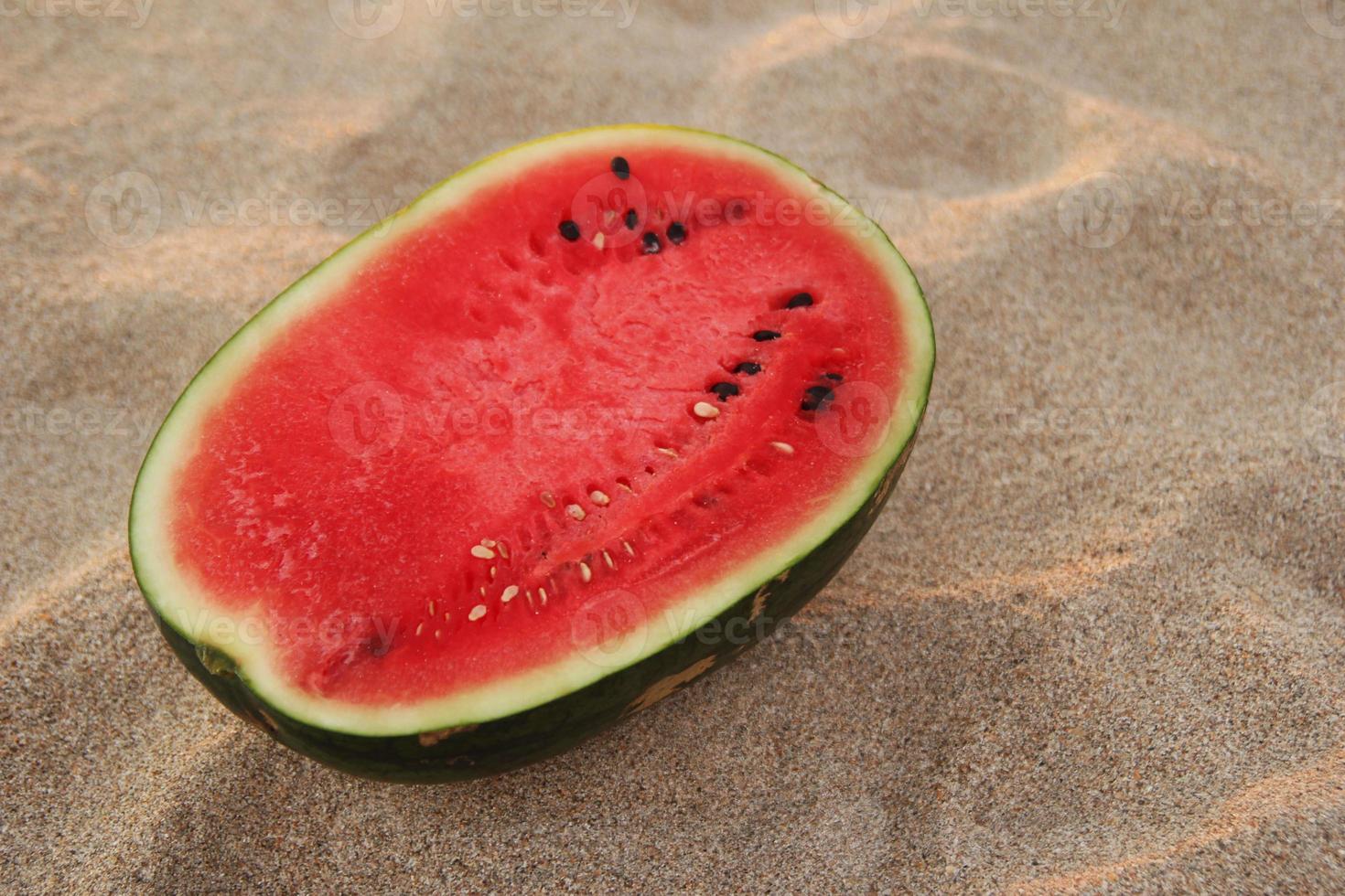 Travel to Koh Lanta, Thailand. A watermelon on the sandy beach on the sunset. photo