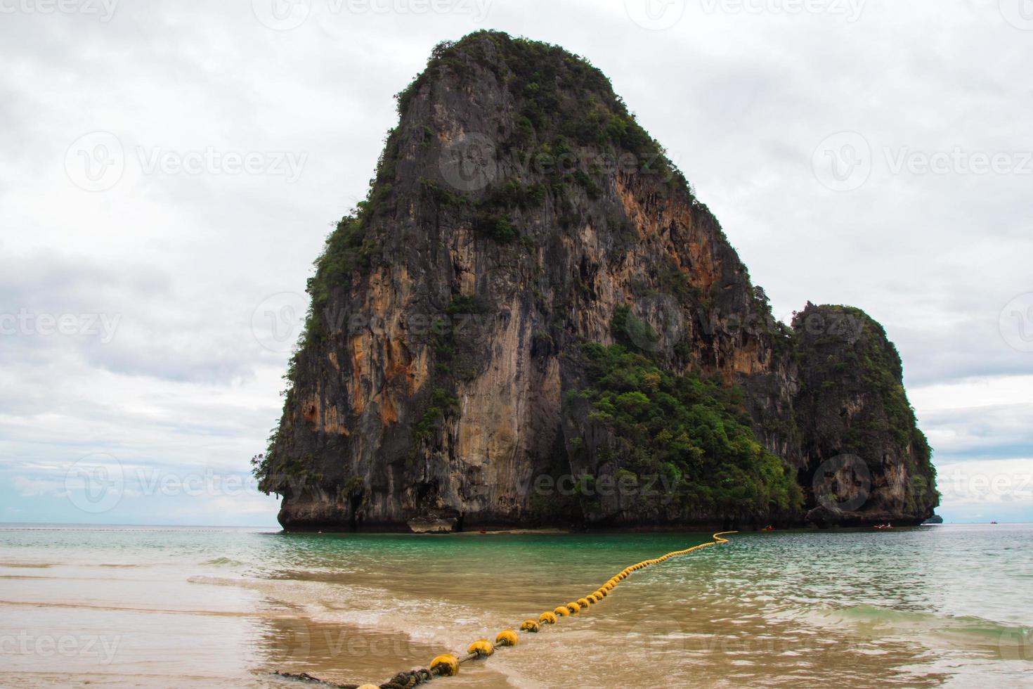 Travel to Krabi, Thailand. The scenic view on the sea and a rock from Phra Nang Beach. photo