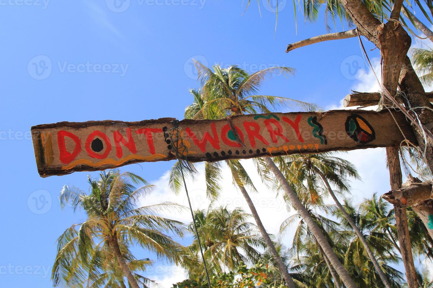 Koh Lanta, Thailand. An inscription - Dont worry - on the wooden abandoned hut. photo