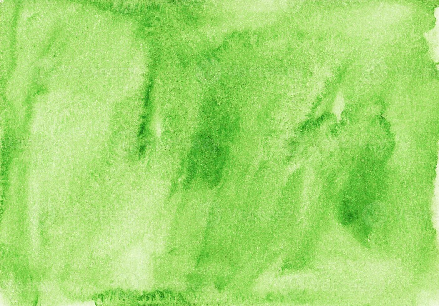 Watercolor light green background texture. Aquarelle kelly green color backdrop. Stains on paper photo