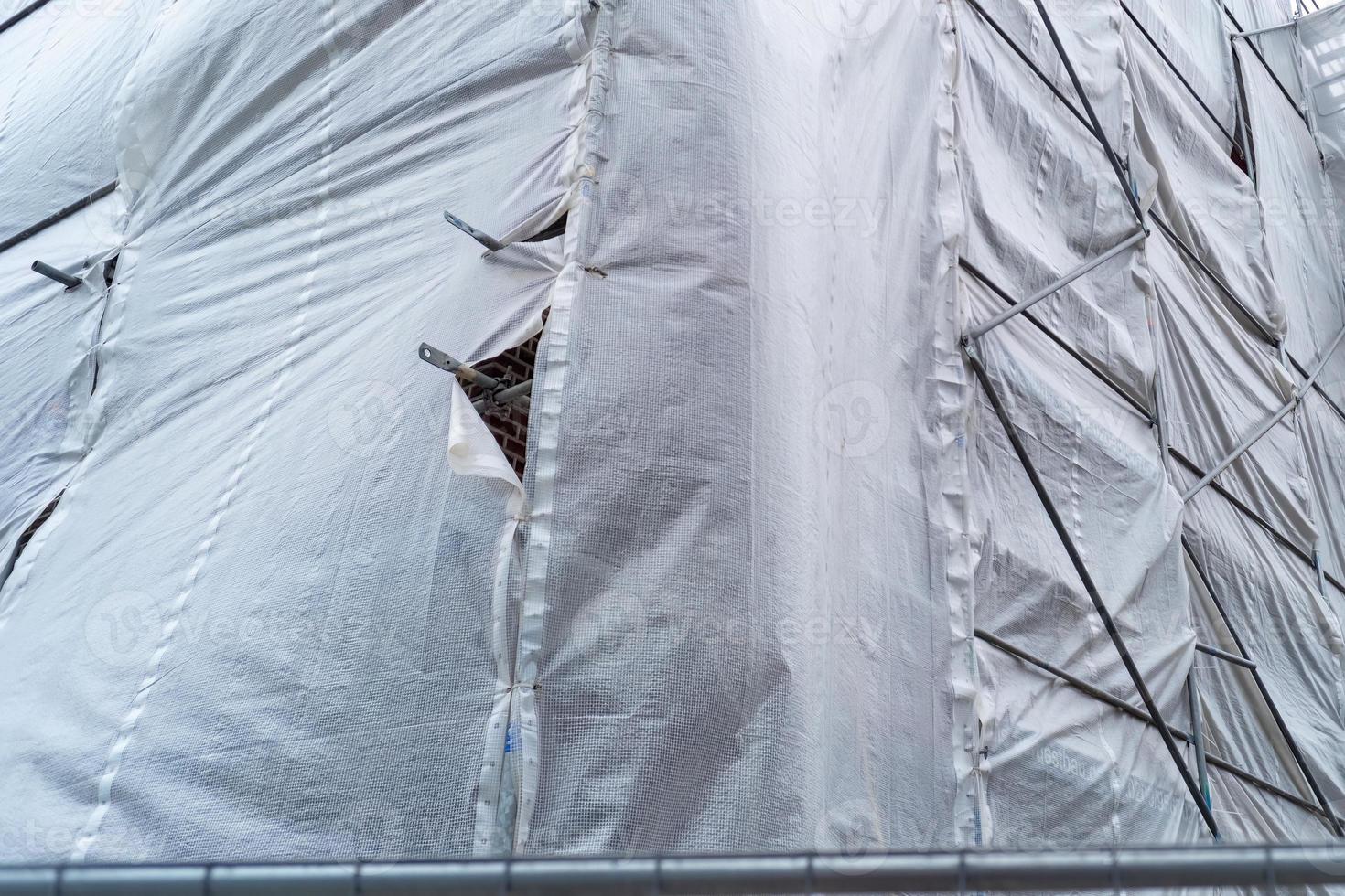 Building covered with a tarpaulin photo