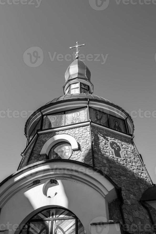 Christian church cross in high steeple tower for prayer photo