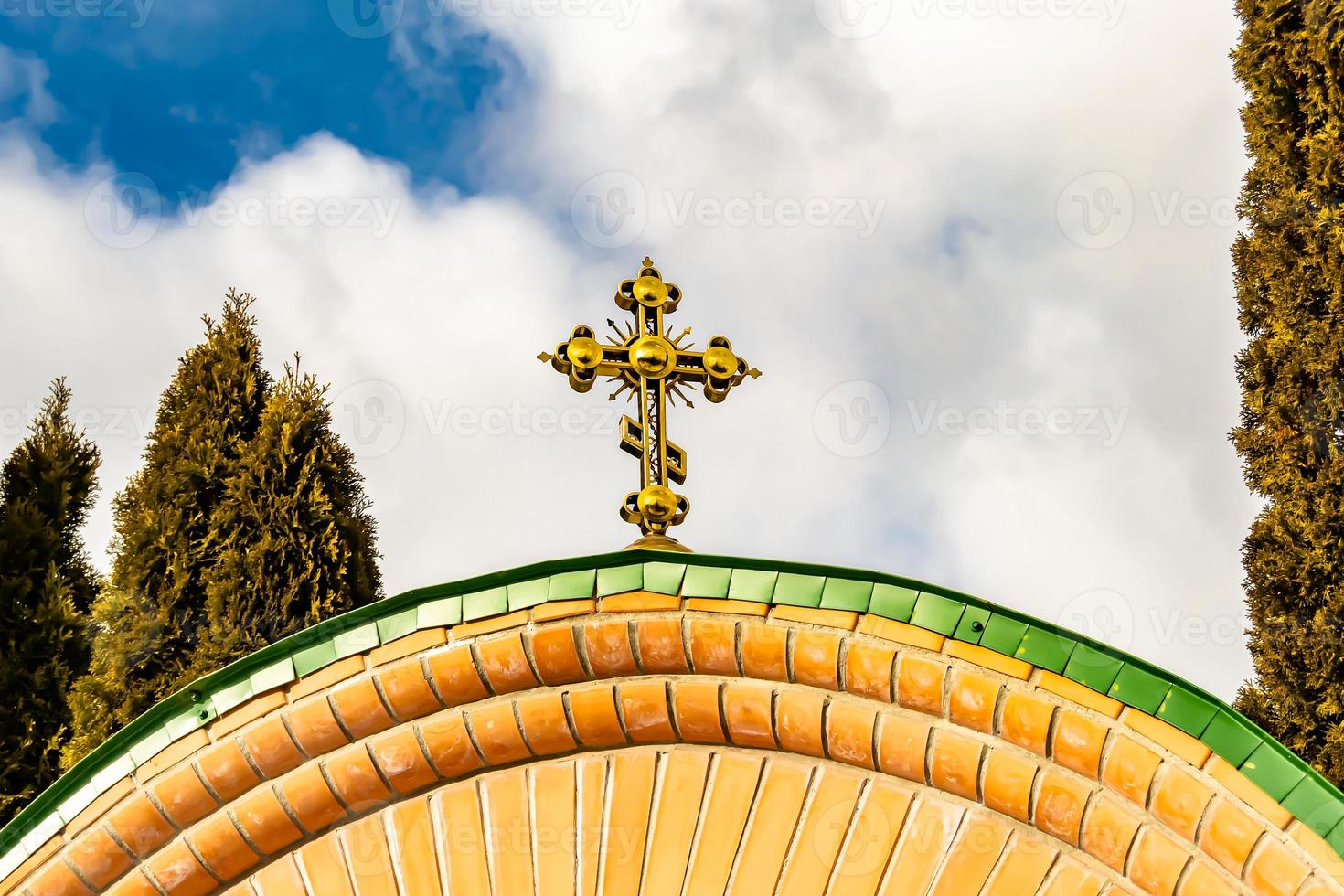 Christian church cross in high steeple tower for prayer photo