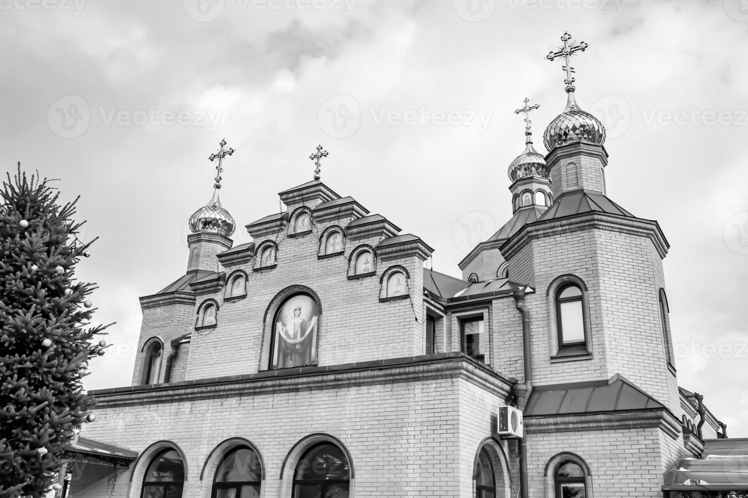 Christian church cross in high steeple tower for prayer photo