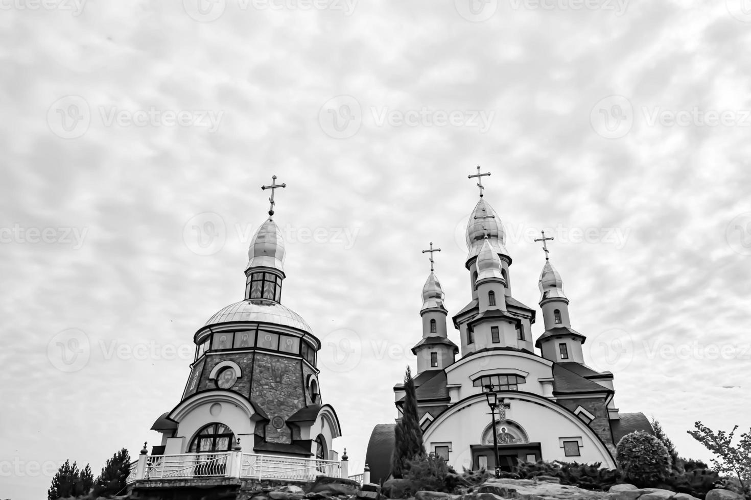 Christian church cross in high steeple tower for prayer photo