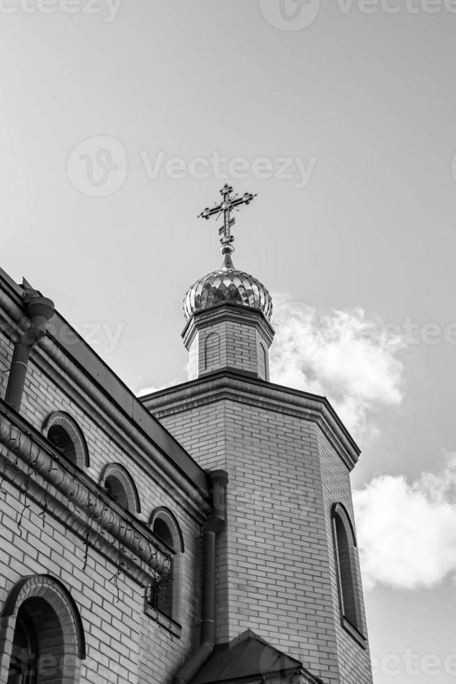 Christian church cross in high steeple tower for prayer photo