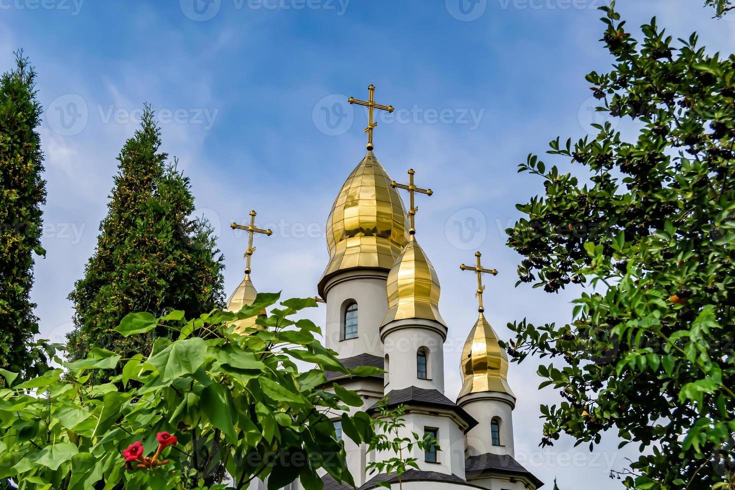 Christian church cross in high steeple tower for prayer photo