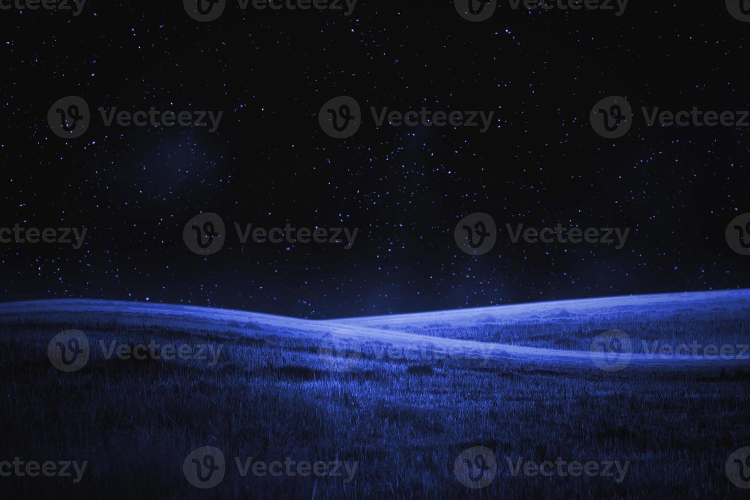 empty grassland hill and nightsky photo