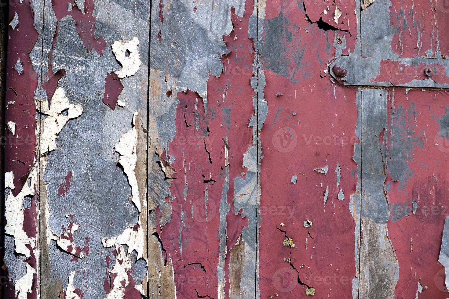 Detailed and colorful close up at cracked and peeling paint on concrete wall textures in high resolution photo