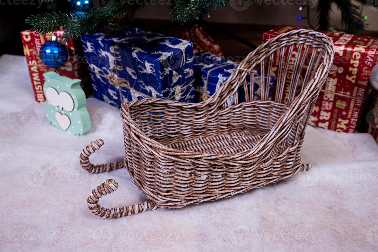 Christmas, New Year interior with red brick wall background, decorated fir tree with garlands and balls, dark drawer photo