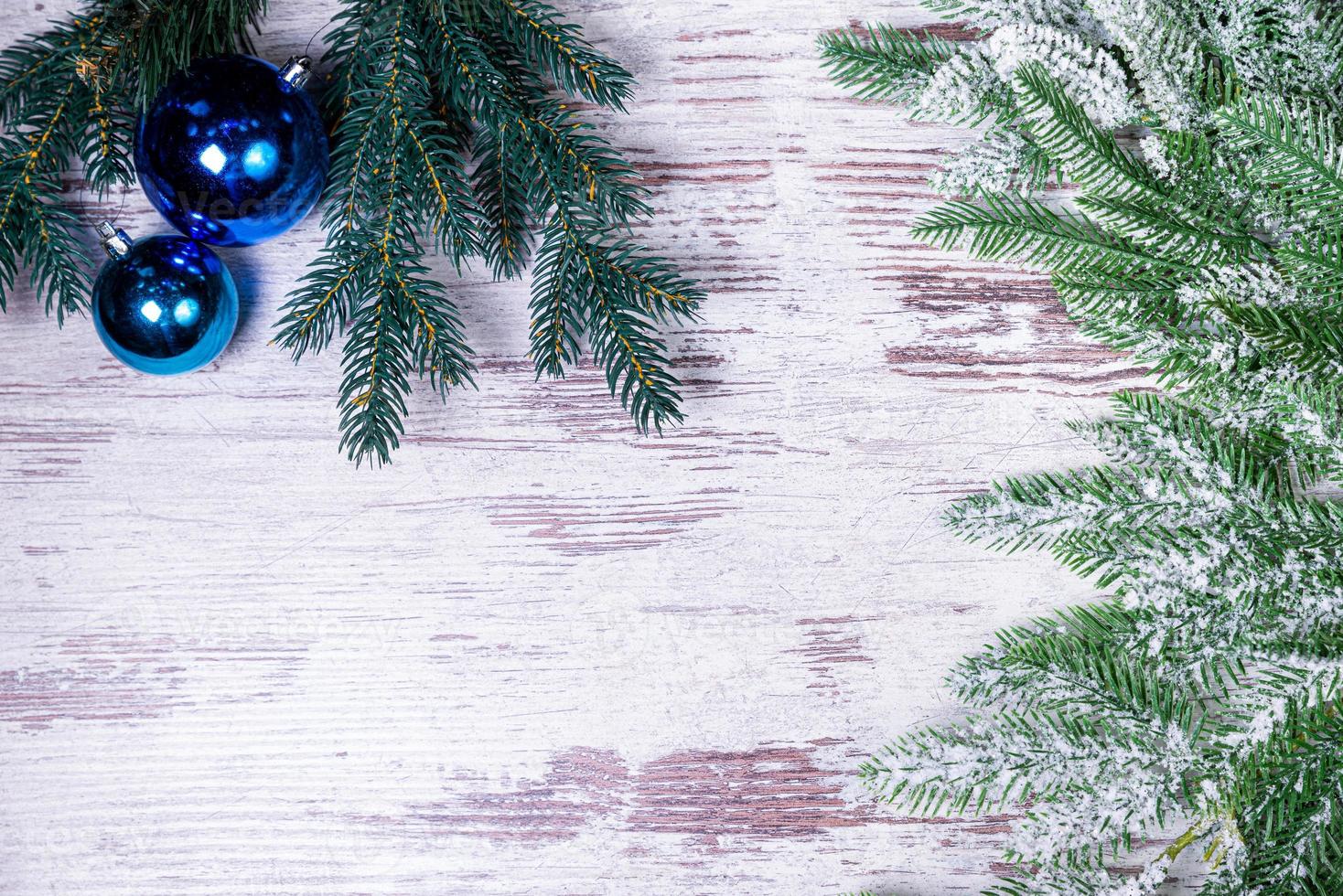 Flat lay composition with serpentine streamers and Christmas decor on wooden background. Space for text Balls, branches, hat, photo