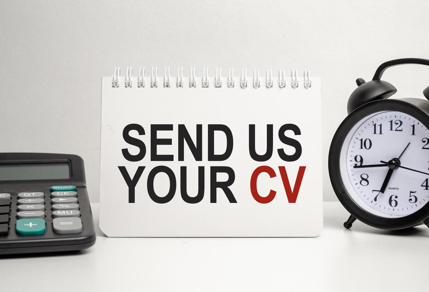 send us your cv words with calculator and clock with notebook photo