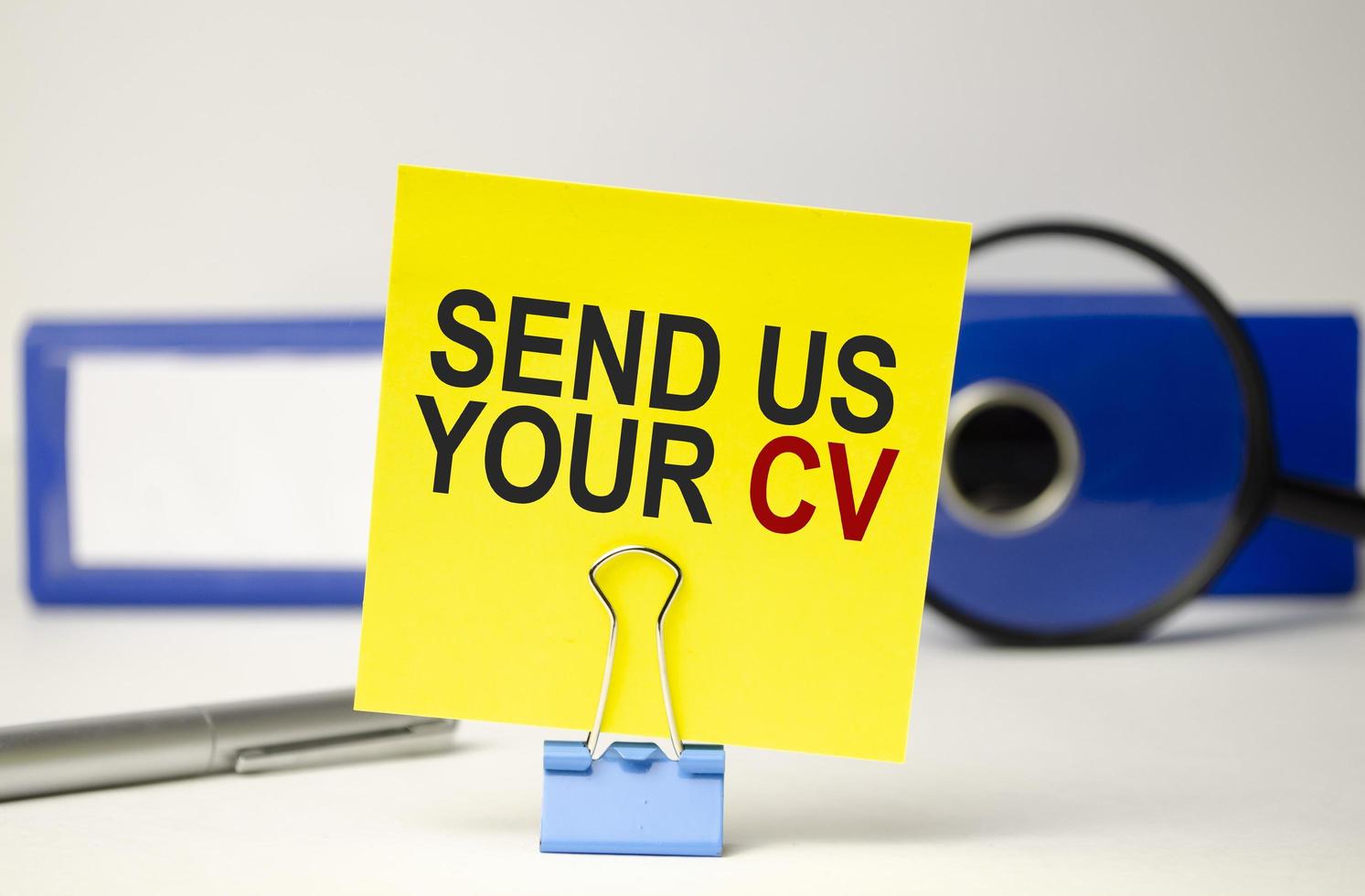 yellow, sticker paper folder, pen and send us your cv words photo