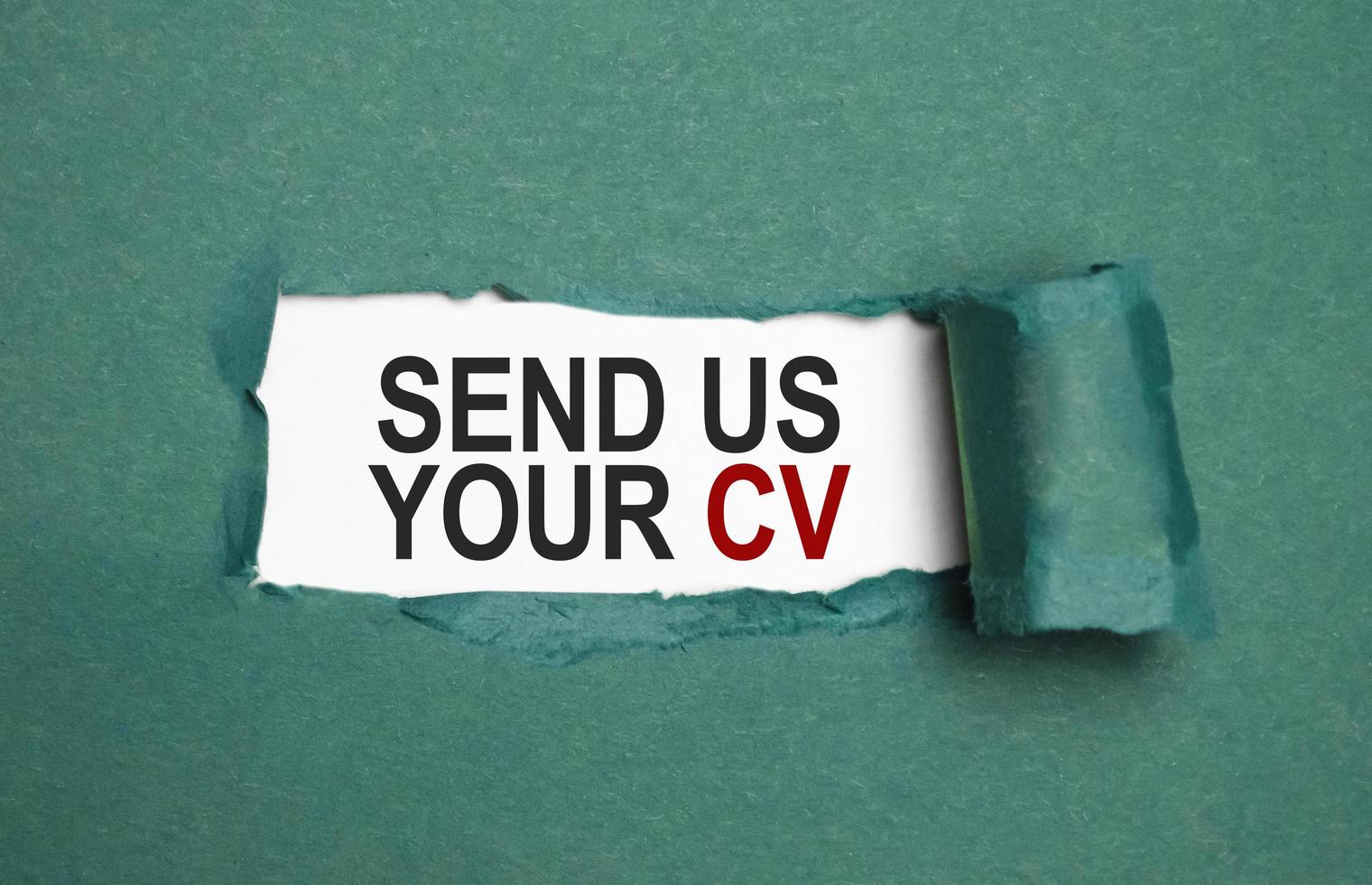 send us your cv on torn paper with green paper photo