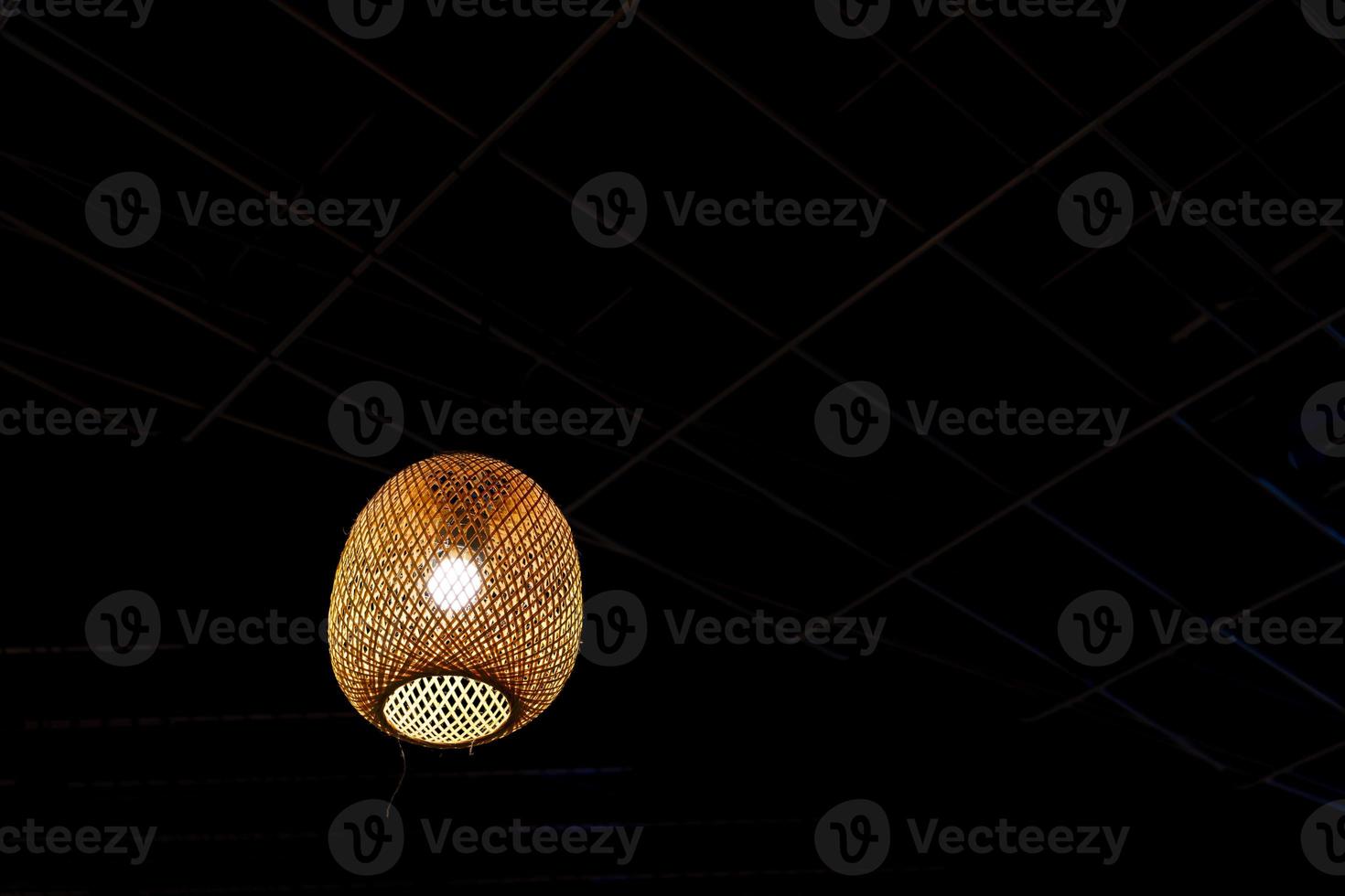 Decorative the bamboo ceiling lamp with clipping path, Hanging Yellow Lamp, warm light wooden lamp. Beautiful interior of the confectionery studio. photo