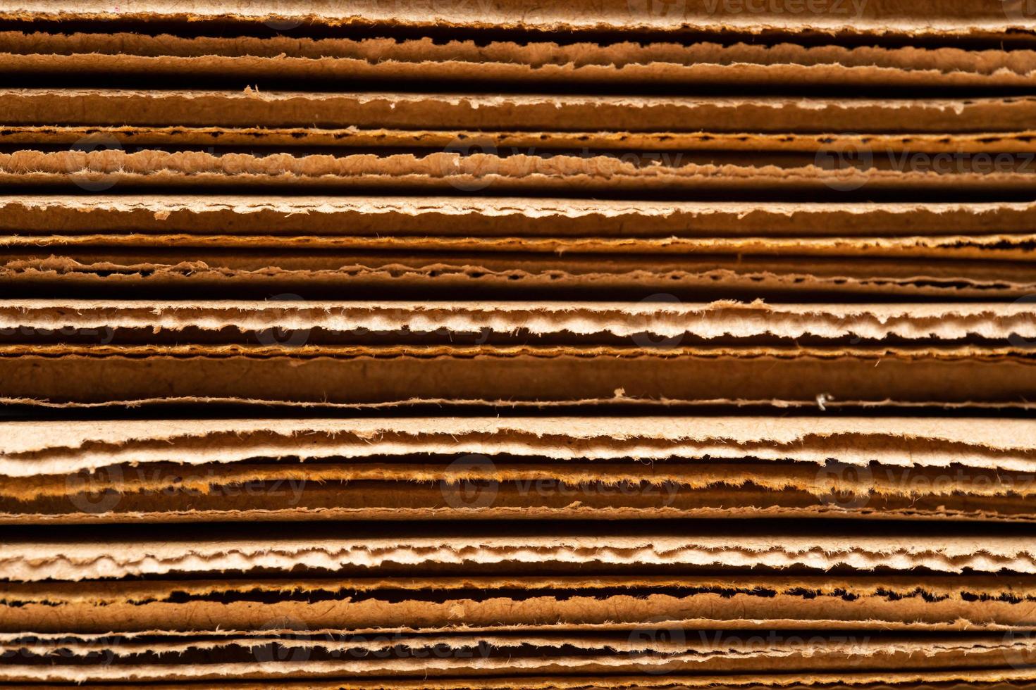 corrugated cardboard for packing. abstract background horizontal lines with wavy lines. Stack of unpacked not assembled cardboard box. photo