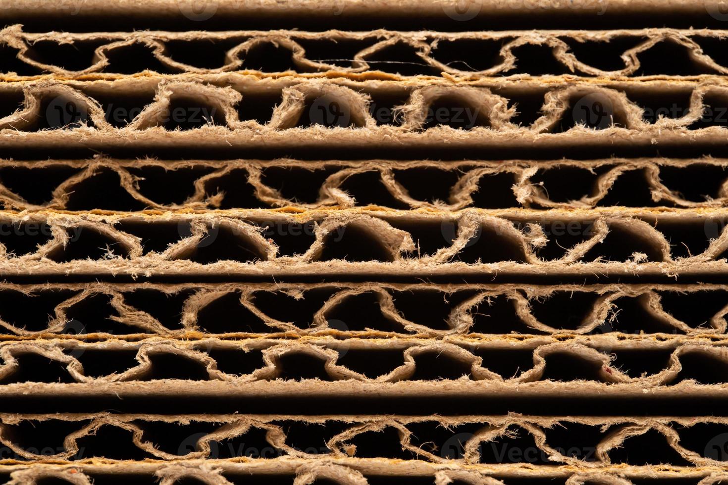 corrugated cardboard for packing. abstract background horizontal lines with wavy lines. Stack of unpacked not assembled cardboard box. photo