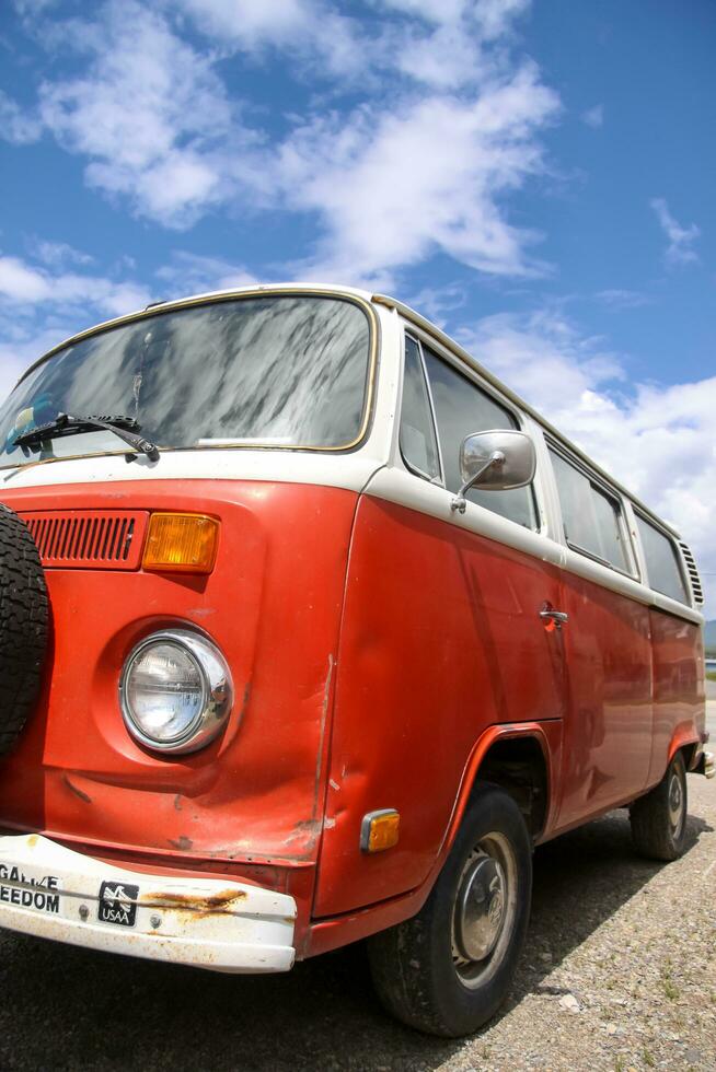 Red VW bus type 2 vintage campervan. The concept for the Type 2 is credited to Dutch Volkswagen importer Ben Pon. photo