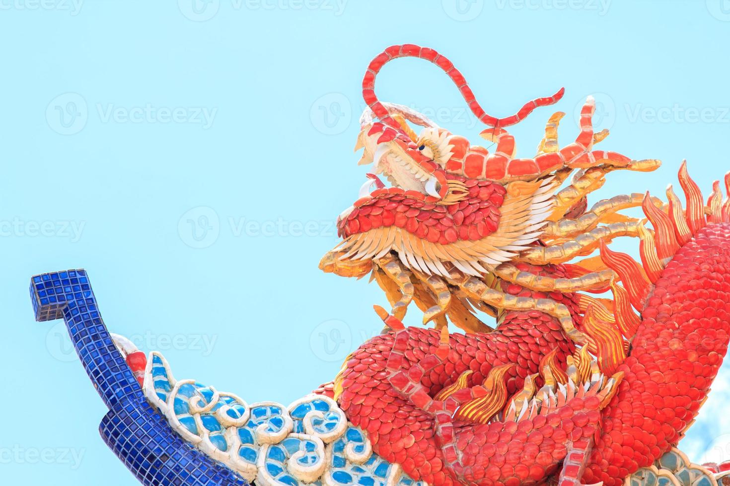 Dragon statues, a mythical creature in Chinese literature, are often decorated in temples and on the roof as beautiful sculptures and blue skies. photo