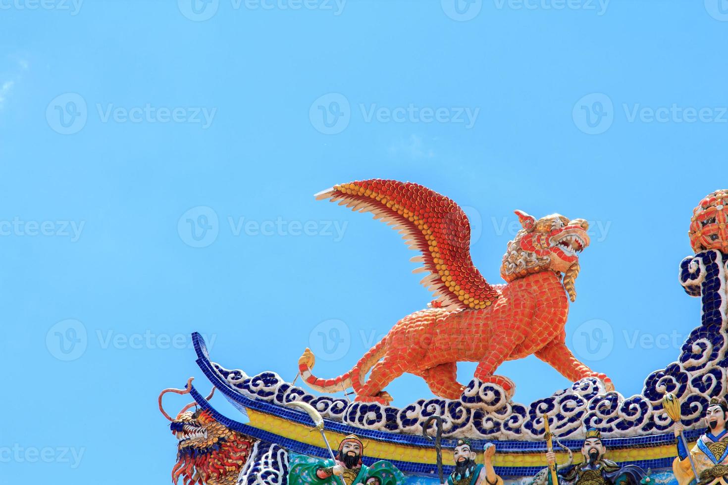 Flying tiger statues, a mythical animal in Chinese literature, are often decorated in temples and on the roof as beautiful sculptures. photo