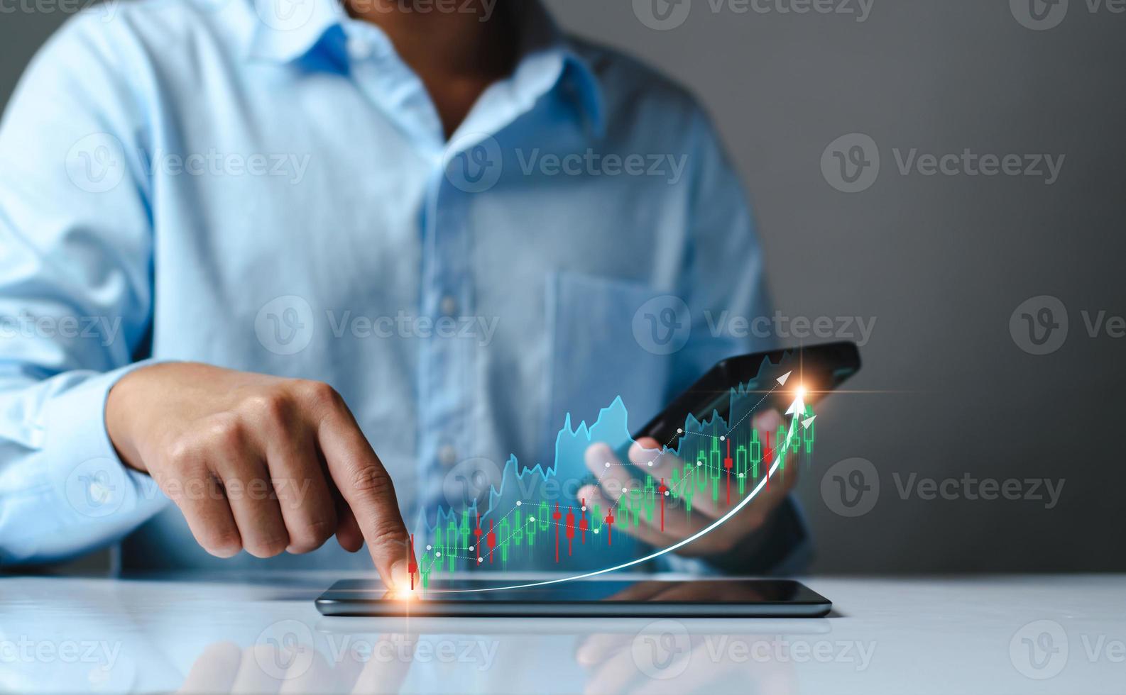 planning and strategy, Stock market, Business growth, progress or success concept. Hand of Businessman or trader touching showing a growing virtual hologram stock on smartphone, invest in trading. photo