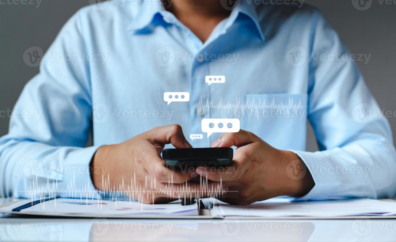 Man hand using smartphone typing Live chat chatting and social network concepts, chatting conversation working at home in chat box icons pop up. Social media marketing technology concept. photo