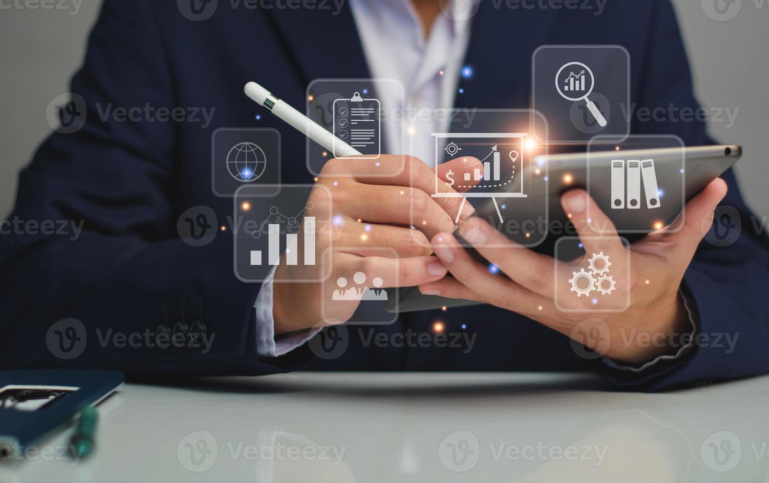 business management concept. development and management Executives looking tablet virtual screen business management icons Goal setting, information, workflows, optimal business operations, innovation photo