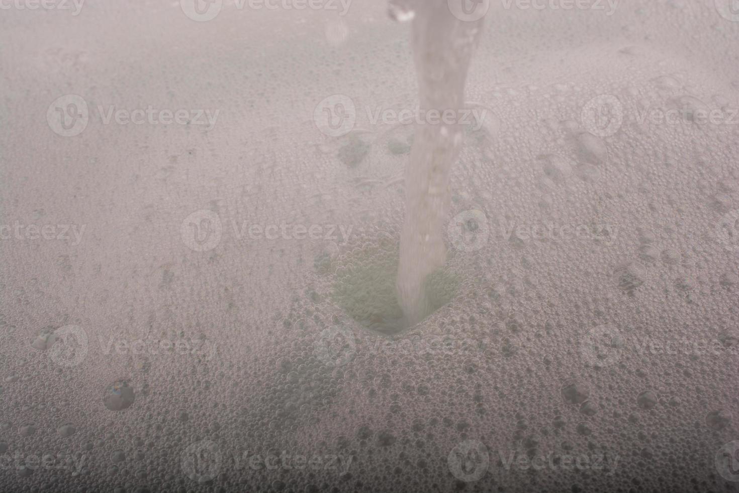 Water covered with foam of shampoo photo