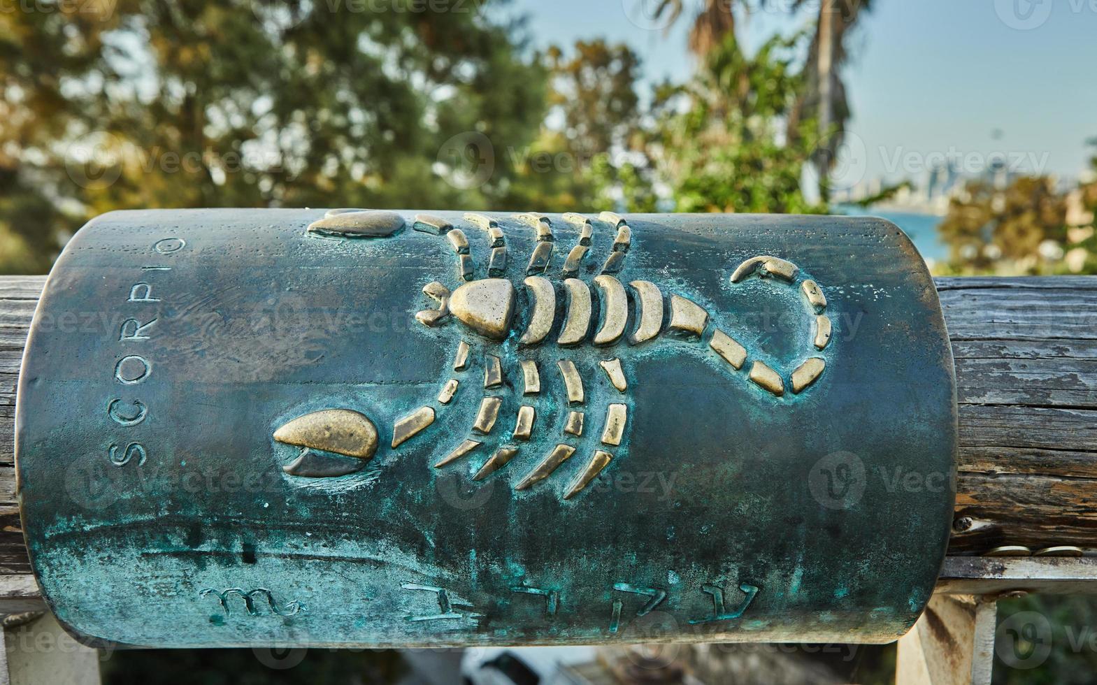 Zodiac sign scorpio on the wishing bridge in old Jaffa. Hebrew inscription Scorpio photo