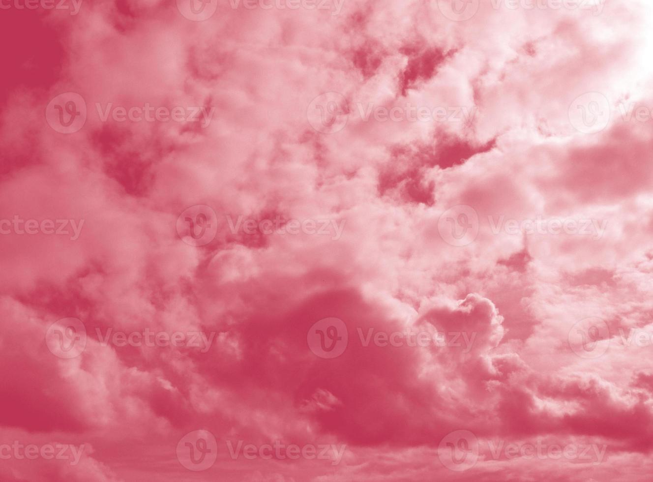 Beautiful fluffy white cloud against the Magenta sky. Sky clouds. Abstract background texture. Copy space. The concept of hope. Color 2023 Viva Magenta photo