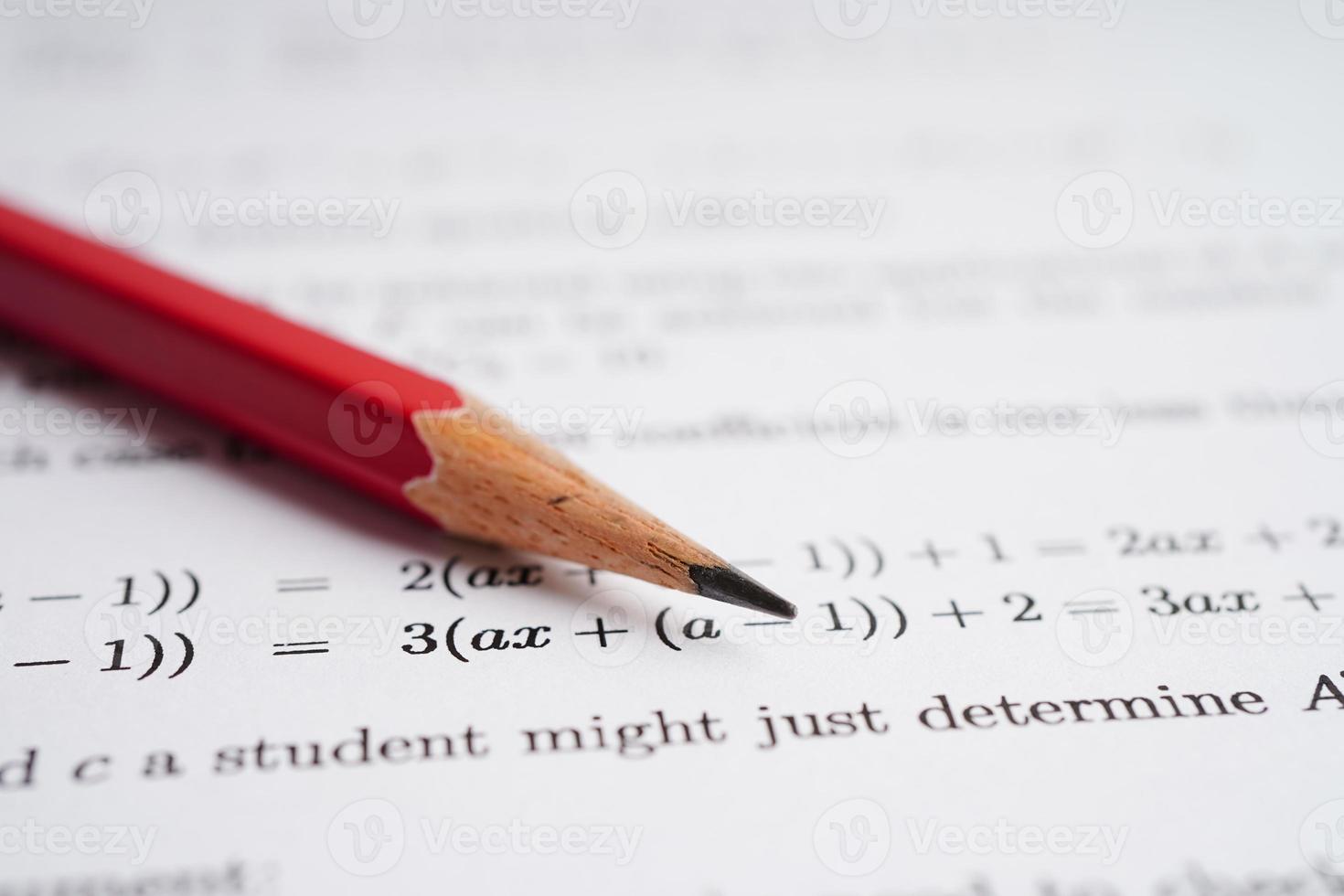 Pencil on mathematic formula exercise test paper in education school. photo