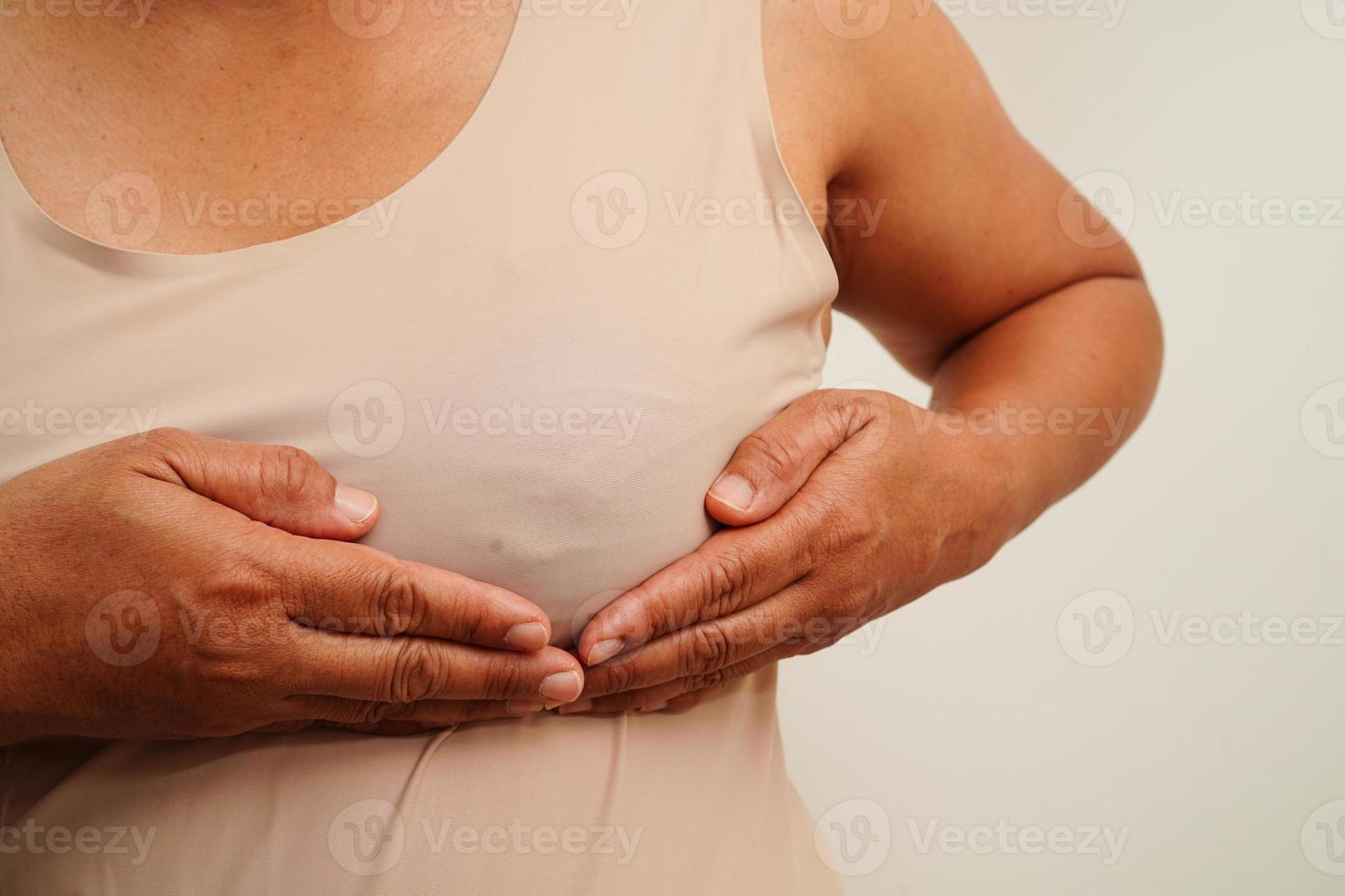 Asian woman self touching check lump or Breast cancer, Breast Self Exam. photo