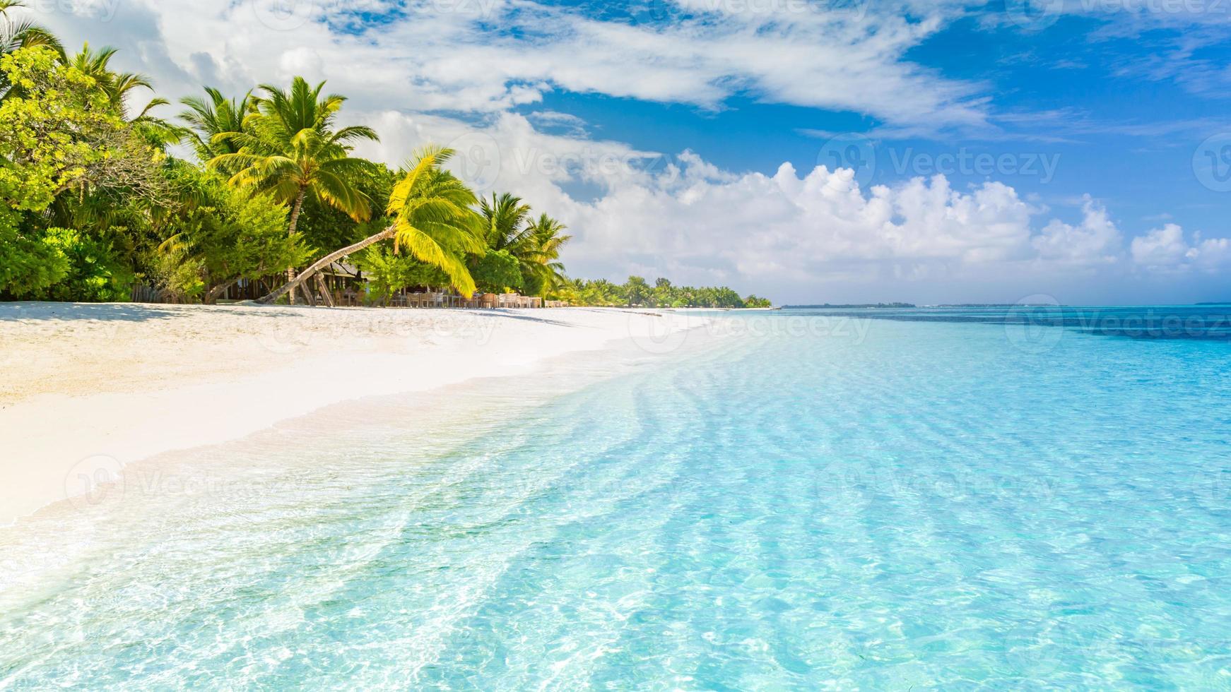 Beautiful beach. Tropical beach background as summer landscape, white sand and calm sea for beach banner. Perfect beach scene vacation and summer holiday concept. Boost up color process photo