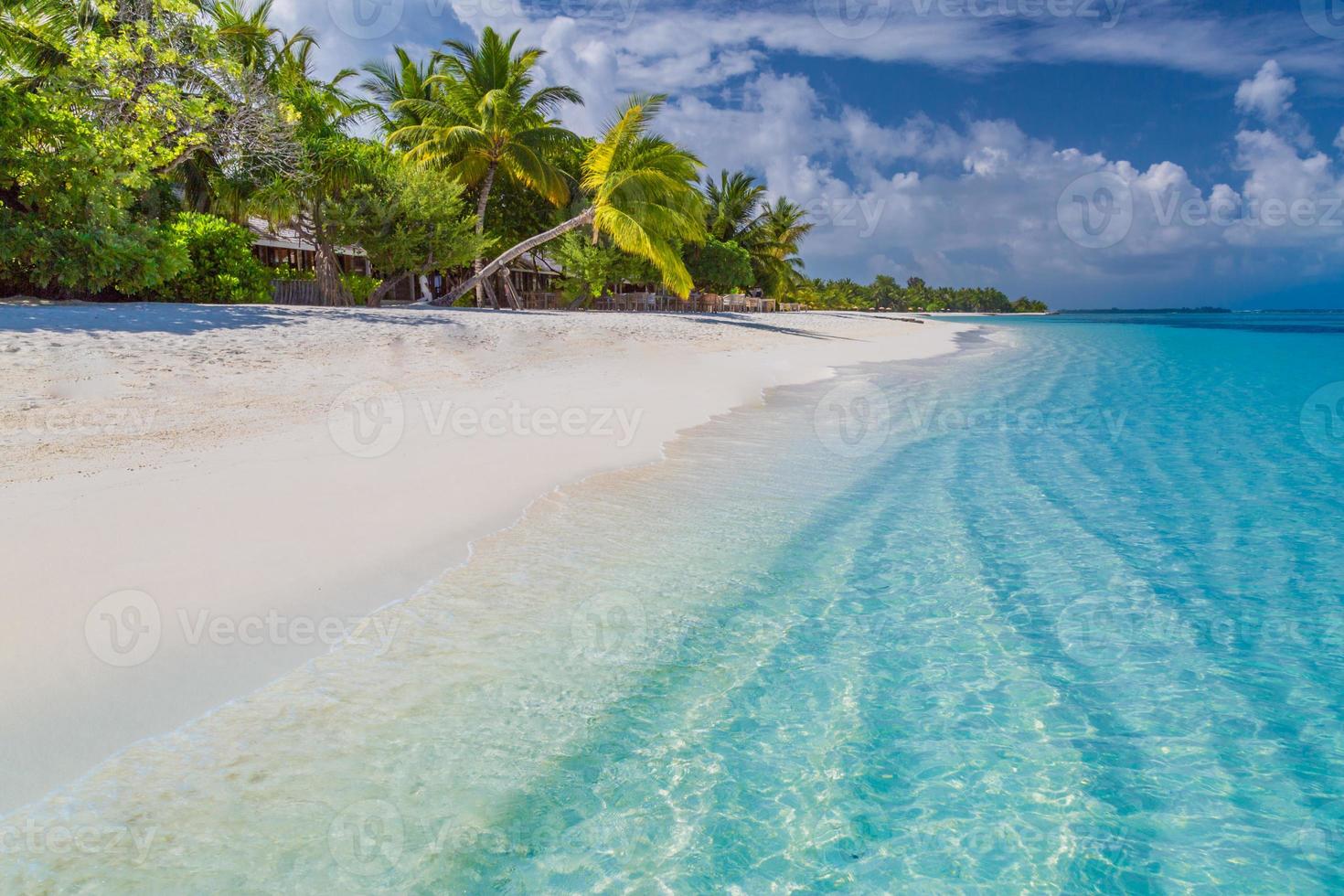 Beautiful beach. Tropical beach background as summer landscape, white sand and calm sea for beach banner. Perfect beach scene vacation and summer holiday concept. Boost up color process photo