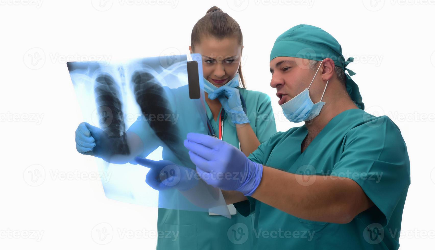 Female radiologists and male doctor checking patient xray. Isolated on white background photo