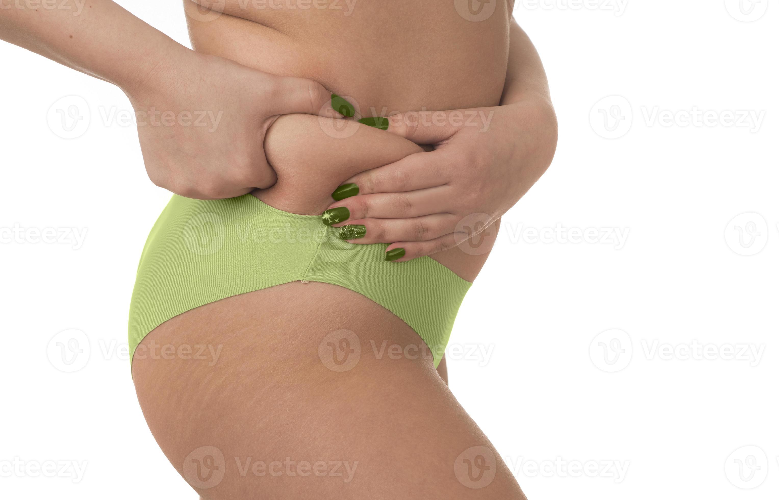 Oversize female pinching skin on her butt for test 15276007 Stock