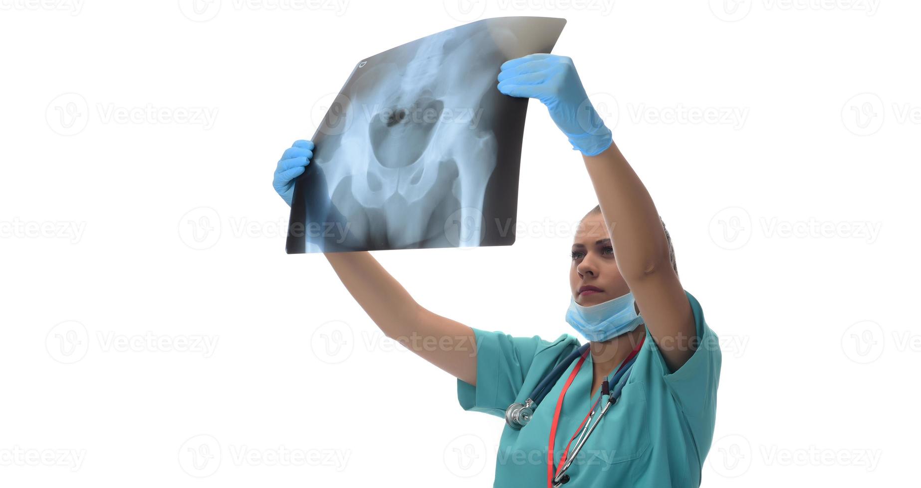 Young female doctor looking at the patient x-ray photo