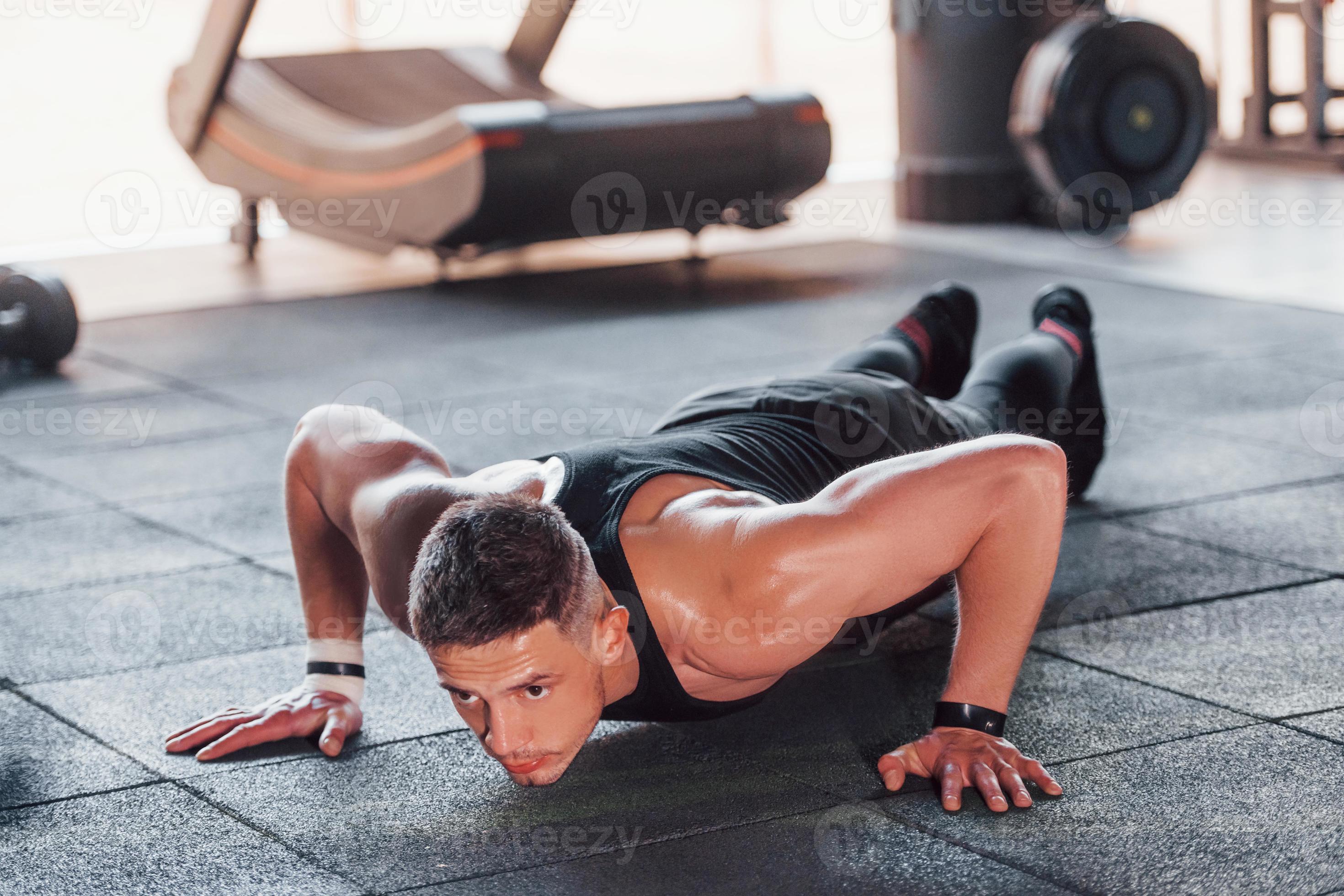 Doing Push ups Young Sportive Strong Man In Black Wear Have Workout doing-push-ups-young-sportive-strong-man-in-black-wear-have-workout
