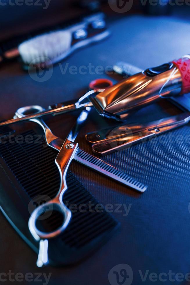 Close up view of vintage barber shop tools that lying down on the table photo