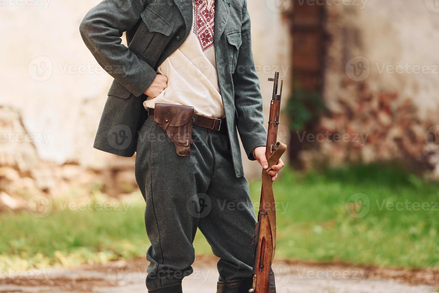 TERNOPIL, UKRAINE - June 2020 UPA Ukrainian Insurgent Army movie filming. Pictures of backstage. Close up view of young soldier with weapon photo