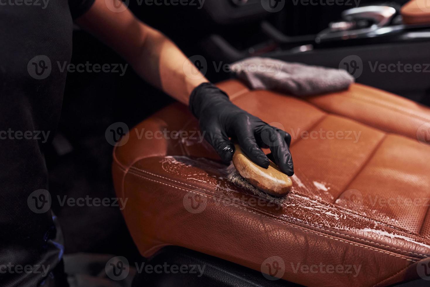 Taking care about brown colored seats. Modern black automobile get