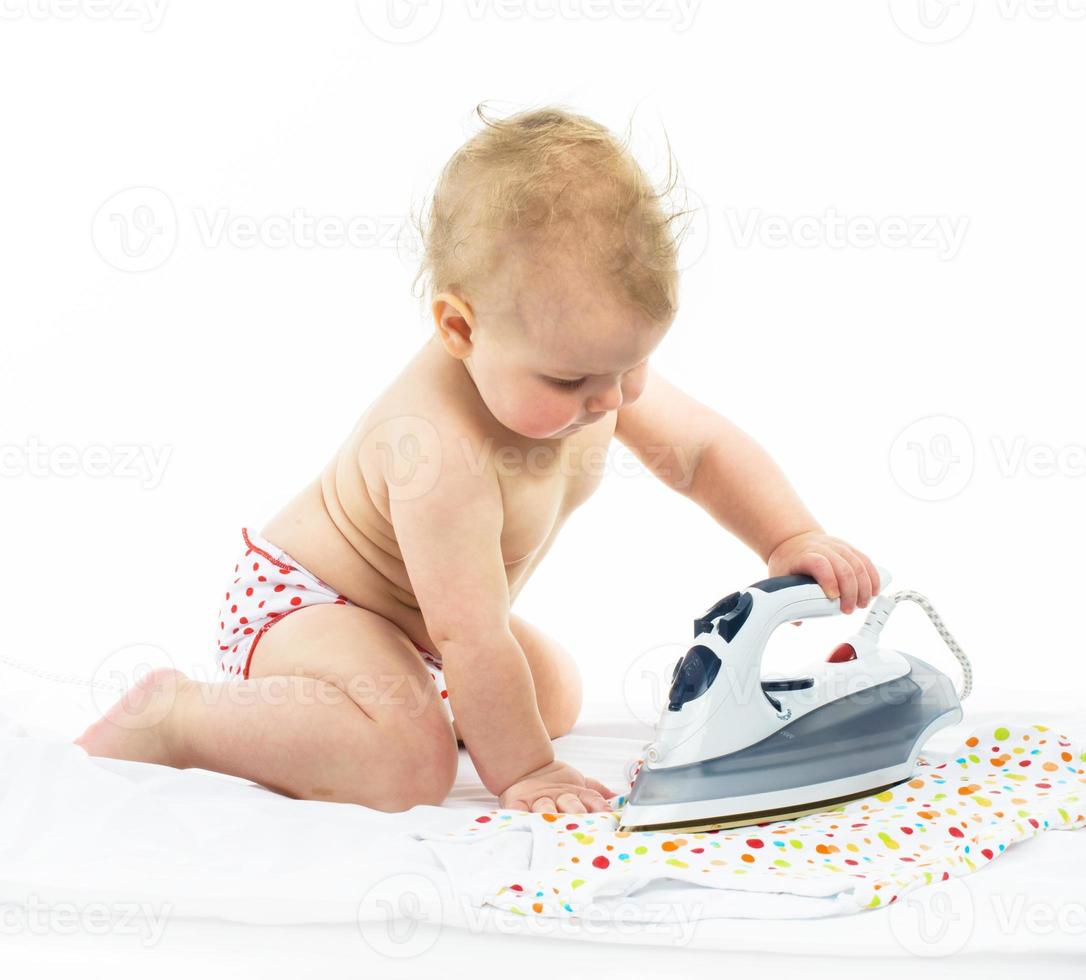 Little girl ironing photo