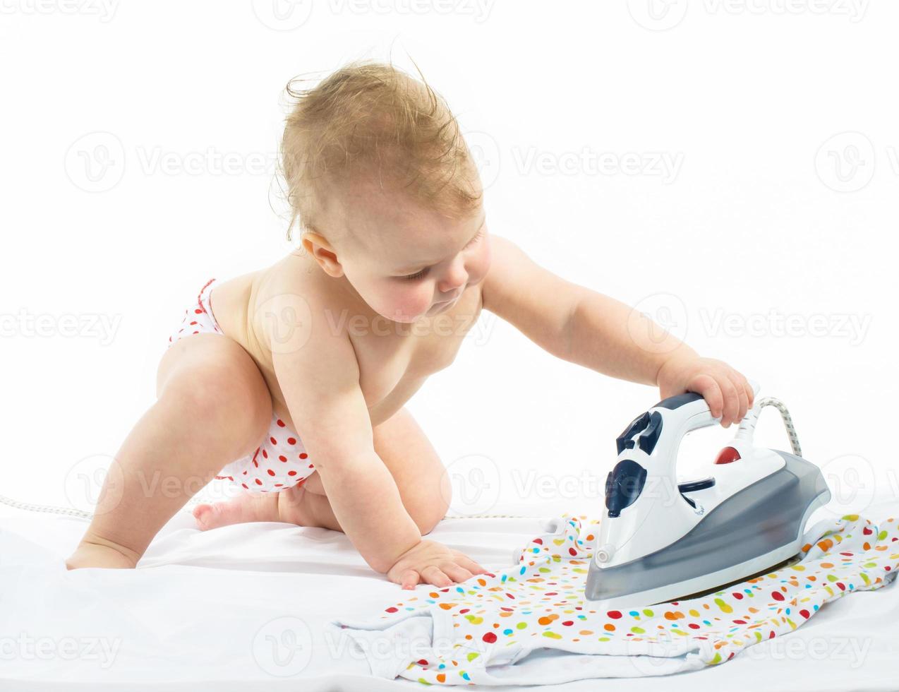 Little girl ironing photo