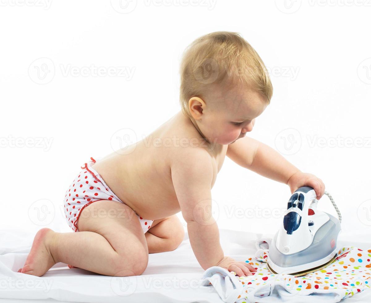 Little girl ironing photo