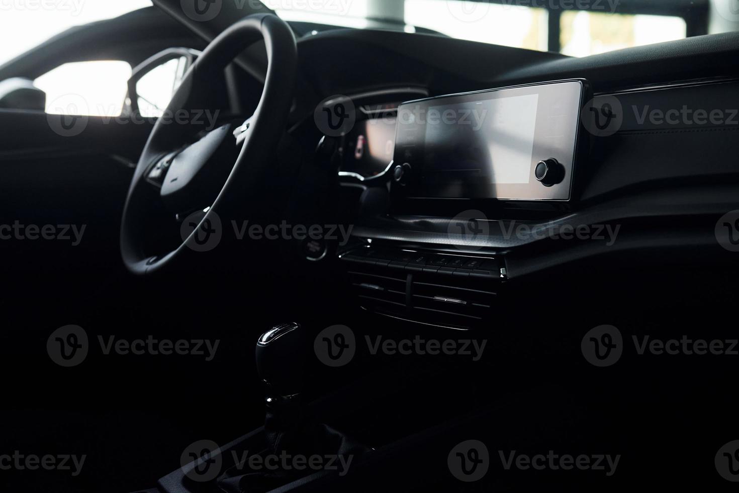 Inside of front part. Close up focused view of brand new modern black automobile photo