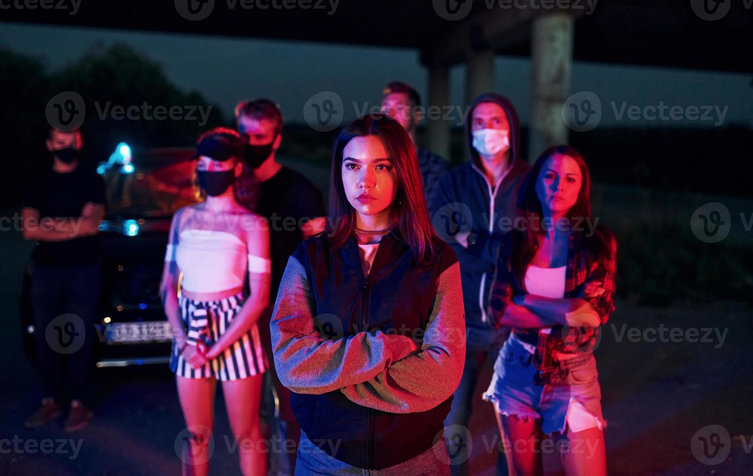 At night time. Group of protesting young people that standing together. Activist for human rights or against government photo