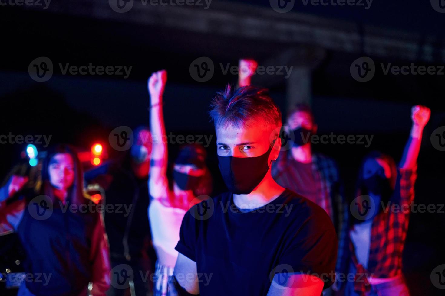 In protective masks. Group of protesting young people that standing together. Activist for human rights or against government photo