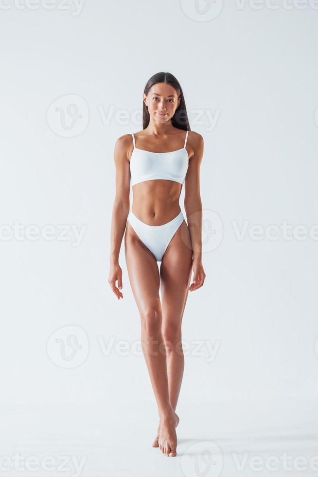 https://static.vecteezy.com/system/resources/previews/015/301/658/non_2x/beautiful-woman-with-slim-body-in-underwear-is-in-the-studio-photo.jpg