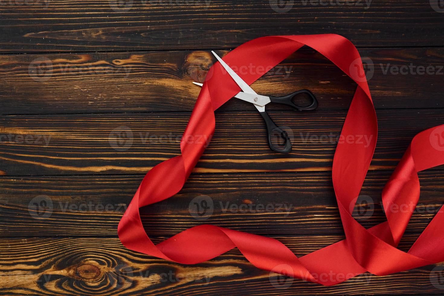 Top view of wooden surface with festive red cloth. Conception of valentine's day photo